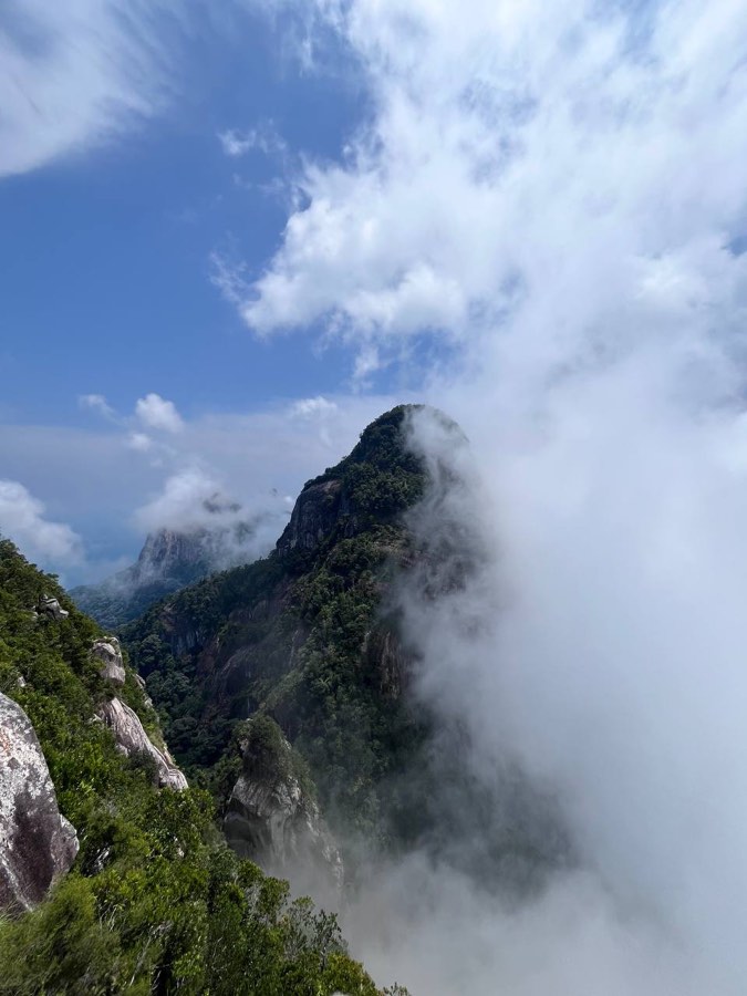 The North Tower wreathed in cloud, seen from the South Tower.